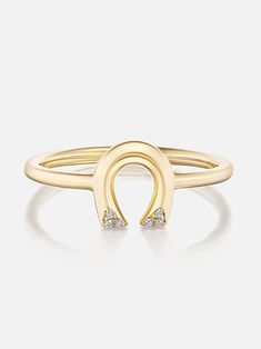 18k yellow gold tiny horseshoe stacking ring with diamond details. Need a little luck on your side? Our tiny horseshoe is Lauren’s ode to one of her childhood passions: horseback riding. As legend has it, wearing a horseshoe facing down allows good fortune to flow out — and don’t we all need a little protection these days? Made to order. The current lead time is 8-10 weeks. Horse Riding, Horseshoe Jewelry, Pyramid Eye, Bridal Bracelet Pearl, Small Wonder, Ring With Diamond, Good Fortune, Stacking Ring, Horseback Riding