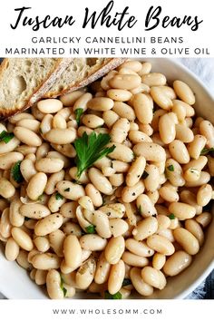 white beans in a bowl with bread on the side and text overlay that reads, toscan white beans