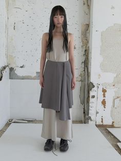 Knee-length, A-line skirt with asymmetric draping and uneven hem. Regular waist and raw cut hem.- Midi- Regular waist- A-line Asymmetrical Draped Skirt With Lining, Asymmetrical Hem Skirt For Workwear, Asymmetrical Draped Skirt For Work, Chic Relaxed Asymmetrical Draped Skirt, Asymmetrical Pleated Wrap Skirt, Asymmetrical Wrap Skirt, Beige Asymmetrical Relaxed Skirt, Asymmetrical Beige Bottoms For Work, Relaxed Lined Asymmetrical Wrap Skirt