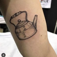 a black and white photo of a tea kettle tattoo