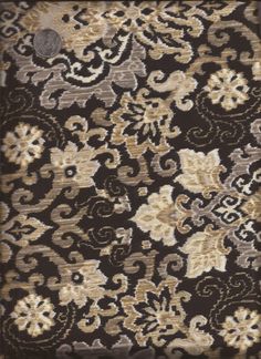 a brown and white floral pattern on a black background with a silver circle in the center