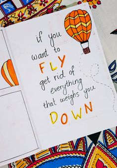 a card with an image of a hot air balloon and the words if you want to fly get rid of everything that laughs you down