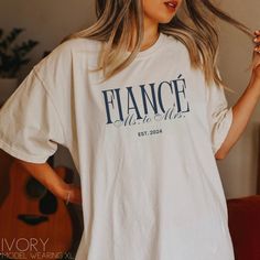 Our classy fiancè shirt is the perfect addition to your engagement personalized with your wedding year! Gift to a friend or sister you know that is newly engaged!  **UNISEX T-SHIRTS- Run true to size. If wanting a more oversized look, selecting 1 or 2 sizes up is recommended. **CUSTOMIZATION-If you would like this design in a different color or on a different item (t-shirt, sweatshirt, tank top, bag, hat, etc.)-please message us and we will do our very best to get it made for you. Placing an ord Engagement Shirt Ideas, Ms To Mrs, Etsy Pod, Engagement Shirts, Wedding Tshirts, Engagement Shirt, Engaged Af, Wedding Shirt, Engaged Shirts