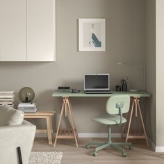 a desk with a laptop computer on top of it