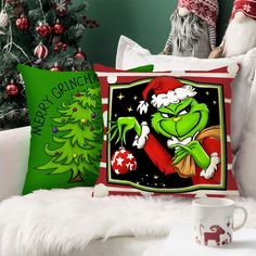 the grinch christmas pillow cover is sitting on a couch next to a christmas tree