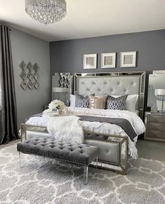 a bedroom with gray walls and silver furniture