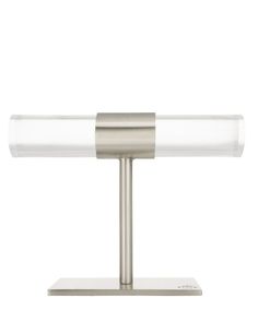 a table lamp that is on top of a metal stand with a white light behind it