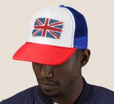 a man wearing a red, white and blue hat with the british flag on it