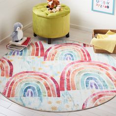 a child's room with a rainbow rug and stuffed animals