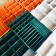 an assortment of different colored plastic storage boxes