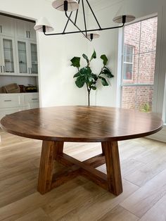 a large wooden table sitting in the middle of a room