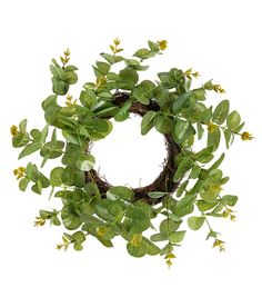 a wreath with green leaves and yellow flowers