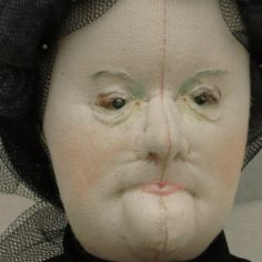 an old woman's face is covered in netting and has eyes wide open to show the wrinkles on her nose