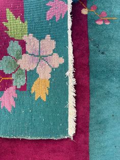 an area rug with flowers and leaves on it