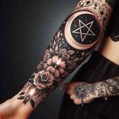 a woman's arm with flowers and a pentagramil on it