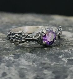 Introducing the enchanting Amethyst Stone Silver Ring by RedFoxSilverCrafts! 🌹✨ Immerse yourself in the captivating beauty of this exquisite ring. Crafted with sterling silver, it showcases a stunning amethyst stone at its center, radiating elegance and spirituality. The intricate design features delicate rose figures that gracefully adorn the band, adding a touch of romance to this timeless piece. 💎 The vibrant purple hue of the amethyst is believed to promote clarity and inner peace, making Nature-inspired Purple Sterling Silver Jewelry, Sterling Silver Hallmarked Amethyst Promise Ring, Hallmarked Amethyst Birthstone Ring For Promise, Purple Sapphire Ring In Sterling Silver For Wedding, Purple Sapphire Ring For Wedding In Sterling Silver, Amethyst Hallmarked Promise Ring, Purple Amethyst Sterling Silver Promise Ring, Hallmarked Amethyst Crystal Promise Ring, Hallmarked Amethyst Crystal Ring For Promise