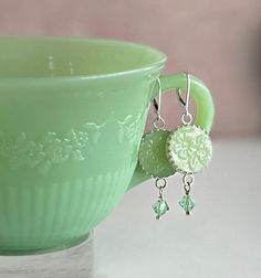 "Jadeite Fire King Earrings, Vintage Jadeite Plate, Jadeite Junkies, Broken China Jewelry, Unique Gifts for Women, Tassel Earrings Artfully repurposed vintage Fire King plate. Sterling Silver. Drop measures 1.50\". 5/8\" round jadeite charm. From top of ear wire to bottom of crystal is 2\" long. Extremely light weight and fluid, they move with you! Our modern make over of this 1940's classic is a must have for every jadeite collector. Charming handcrafted earrings feature this fabulous Alice jad Broken China Jewelry Diy, Broken China Crafts, Adjustable Silver Bracelet, Plate Jewelry, Antique Costume Jewelry, Broken China Jewelry, Unique Jewelry Gifts, Vintage Fire King, Spoon Jewelry