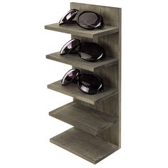 a wooden shelf with sunglasses on it