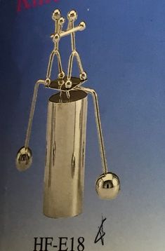 a book with an image of a metal object in the shape of a pendulum wheel