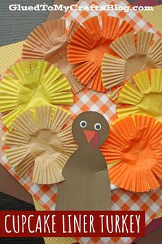 paper cupcake liner turkeys with the words cupcake liner turkey on it and an orange checkered table cloth