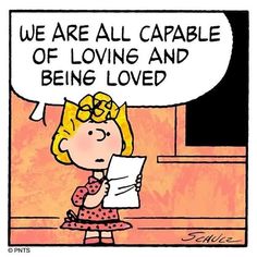 a cartoon girl holding a piece of paper with the words we are all capable of loving and being loved