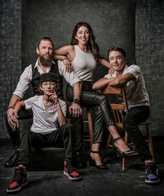 a family posing for a photo in their studio