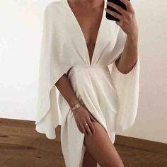 deep v neck lantern sleeve dress chiffon white dress open back long sleeve short dress ruffled trim white mini dresses #minidress #minidresses #lanternsleeve #longsleeve #shortdress #ruffled #whitedress Summer V-neck Mini Dress For Evening, Elegant V-neck Bodycon Dress For Brunch, Elegant V-neck Backless Summer Dress, Spring Bodycon Backless Dress, Chic Backless V-neck Cocktail Dress, Fitted V-neck Backless Summer Dress, Chic Bodycon Backless Dress For The Beach, Summer V-neck Bodycon Dress For Day Out, Spring Bodycon Backless Dress For Date Night