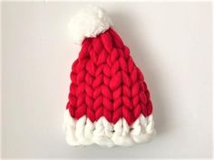 a red and white knitted santa hat