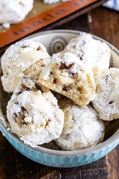 a bowl filled with cookies and powdered sugar