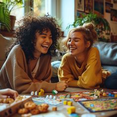 two young women playing board games on the floor