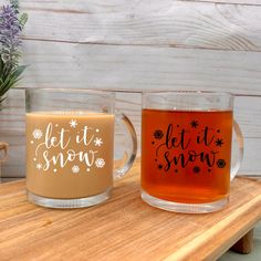 two mugs that say let it snow and let it snow