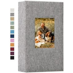 a photo album with an image of a man and two dogs on the front cover