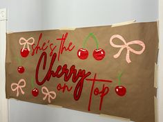 a piece of paper with the words cherry on top and cherries painted on it