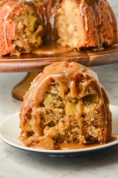 a bundt cake on a plate with caramel drizzle and icing