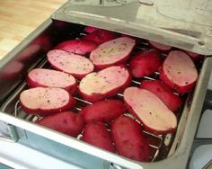 the potatoes are being cooked on the grill in the kitchen, and they're ready to be put into the oven