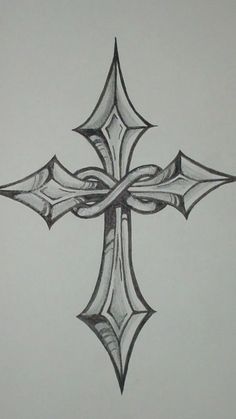 a drawing of a cross that is drawn in black and white pencils on paper