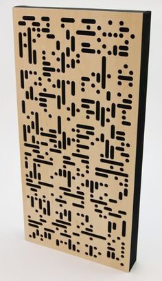 a wooden block with black and white designs on it