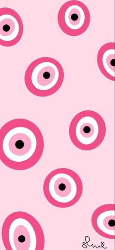 pink and black circles are arranged in the shape of an eyeball on a pink background