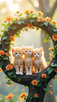 three kittens are sitting in the middle of a wreath with flowers on it and glowing eyes