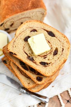 slices of bread with butter and raisins on top