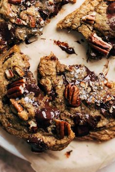 a chocolate chip cookie with pecans on top