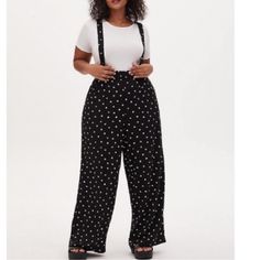 Torrid Disney Mickey Mouse & Minnie Mouse Polka Dot Black Challis Overall Description Fit See Torrid Size Guide Overall Silhouette. Materials + Care Stretch Challis Woven Fabric: Your Favorite Easy-But-Polished Fabric With The Perfect Touch Of Stretch. Stretch Level: Medium. 97% Rayon, 3% Spandex. Machine Wash Cold. Line Dry. Details Square Neckline. Crossed Straps. Mickey Graphic. Disney Collection. Smoker Free Home. Black Pantsuit, Black Cotton Dresses, Blue Dress Pants, Mickey Mouse Minnie Mouse, Black Two Piece, Black Slacks, Flowy Pants, Floral Leggings, Mickey Minnie Mouse