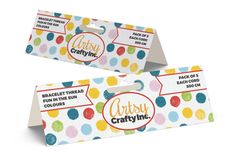 two gift cards with colorful polka dots on them