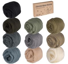 wool rovings in different colors and sizes, including black, white, grey, green