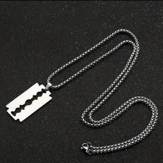 The First 5 Pics Are Stock The Actual Razor Blade Necklace You Will Recive... Add Some Edge To Your Style With This Silver-Colored Razor Blade Pendant Necklace. The Pendant Is Designed In The Shape Of A Razor Blade, With A Chain Necklace Measuring Approximately 23.62 Inches In Length. The Necklace Is Suitable For Both Men And Women. The Pendant's Dimensions Can Be Seen In The Stock Pics & It Has No Stone And A Metal Purity That Is Unknown. The Necklace Is Perfect For Those Who Like To Make A Sta Bagpack Outfit Style, Blade Necklace, Razer Blade, Accessory Inspo, Razor Blade, Mens Accessories Jewelry, Outfit Style, Bagpack, Dream Closet