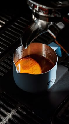 a pan with some food cooking on top of it