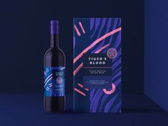 a bottle of tiger's blood wine next to a box on a blue background