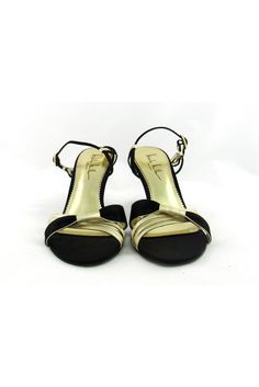 Style these strappy gold & black sandals with any evening dress. Made with a small heel, you will be able to dance the night away in these fabulous shoes. Size 7.5 B Leather & fabric upper Leather sole Gold-tone buckle Strappy style Open toe Light outsole wear Mark on interior lining Heel height 3.5" Gold Slingback Sandals For Evening With Padded Heel, Gold Sandals With 4-inch Heel For Prom, Gold Ankle Strap Slingback Sandals For Evening, Gold Sandals With 4-inch Heel For Evening, Gold Evening Sandals With 4-inch Heel, Gold Strappy Evening Sandals, Gold Evening Sandals With Padded Heel, Gold Sandals With Padded Heel For Evening, Gold Fitted Strappy Sandals