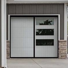 an open garage door on the side of a house