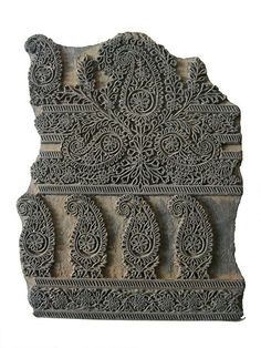 an intricately carved wall panel on display